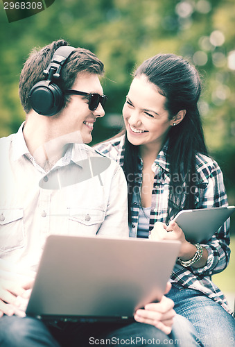 Image of students or teenagers with laptop computers