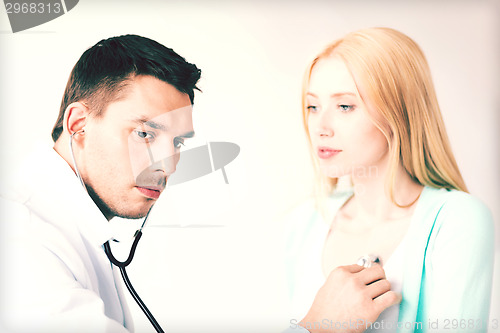 Image of male doctor with patient