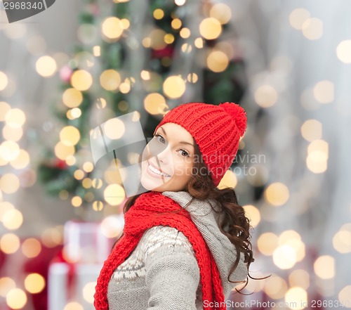 Image of smiling young woman in winter clothes