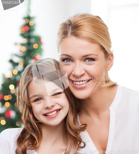 Image of smiling mother and little girl