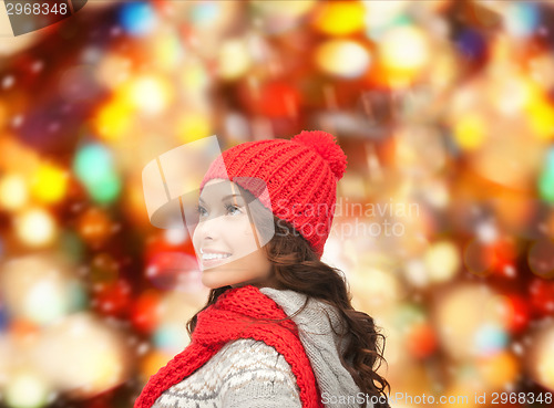 Image of smiling young woman in winter clothes