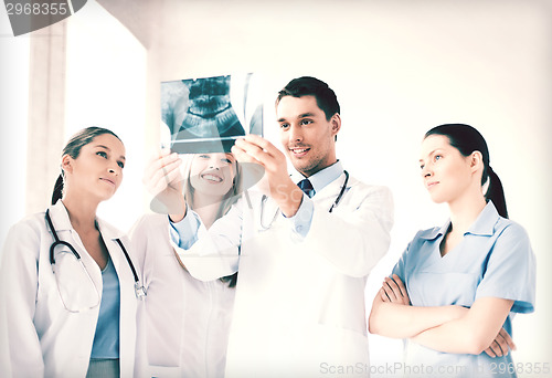 Image of young group of doctors looking at x-ray