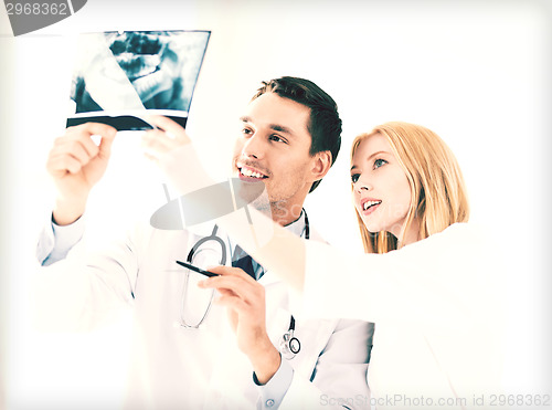 Image of two doctors looking at x-ray