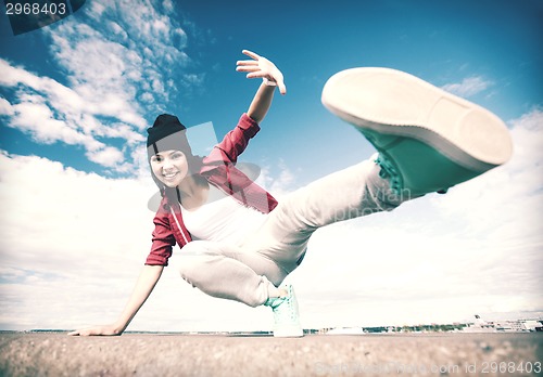 Image of beautiful dancing girl in movement