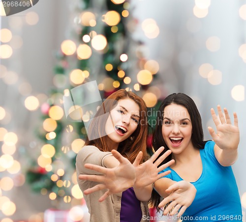 Image of smiling teenage girls having fun