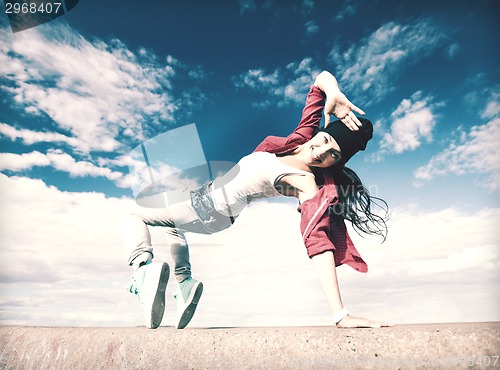 Image of beautiful dancing girl in movement