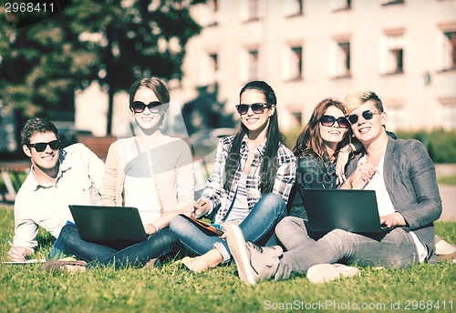 Image of students or teenagers with laptop computers