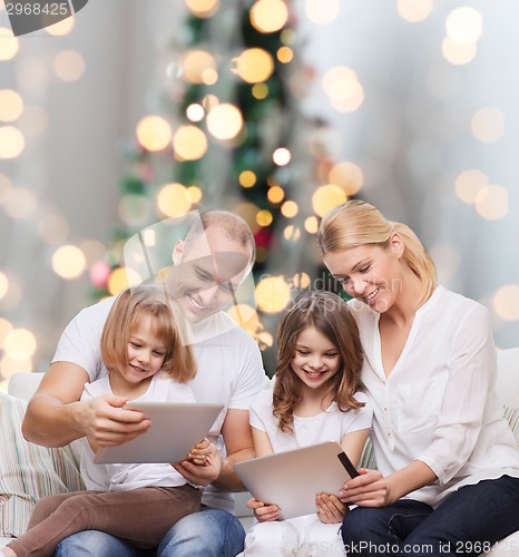 Image of happy family with tablet pc computers