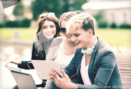 Image of students or teenagers with laptop computers
