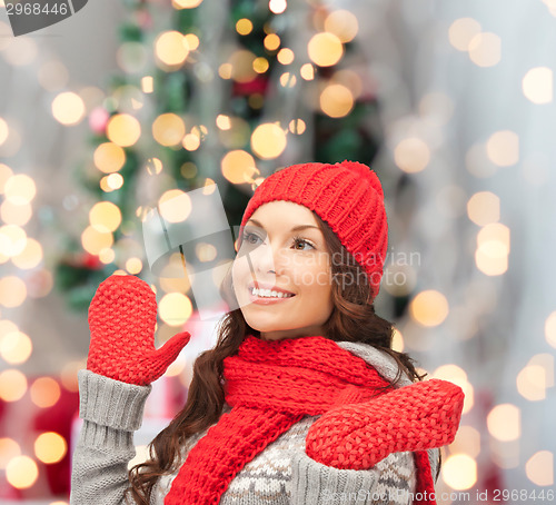 Image of smiling young woman in winter clothes