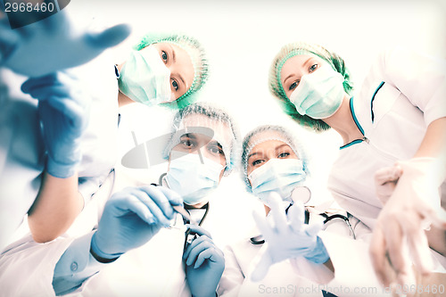Image of group of doctors in operating room