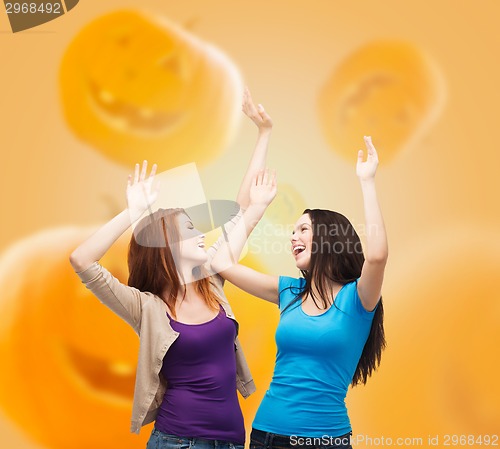 Image of smiling teenage girls having fun