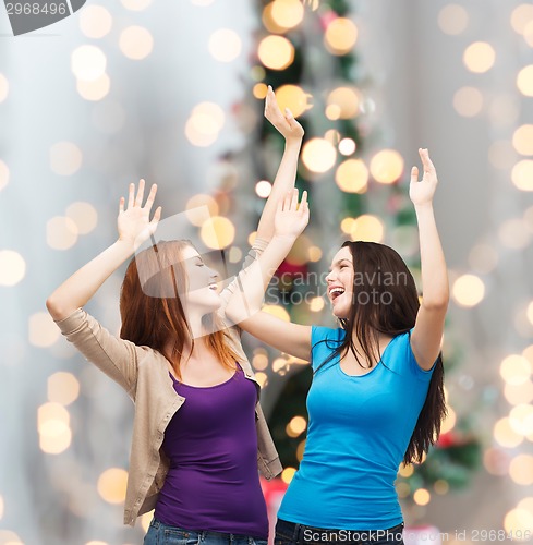 Image of smiling teenage girls having fun