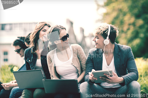Image of students or teenagers with laptop computers