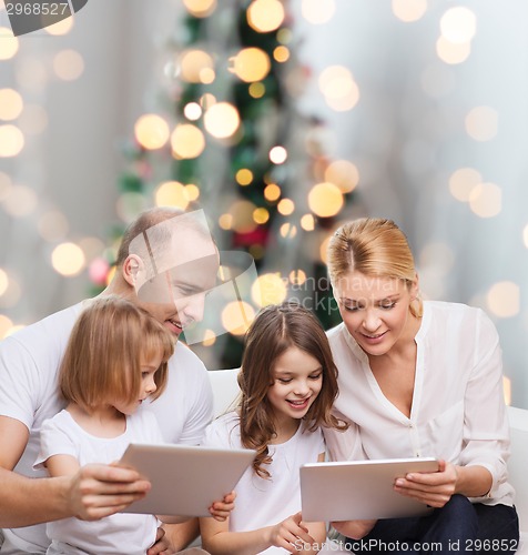 Image of happy family with tablet pc computers