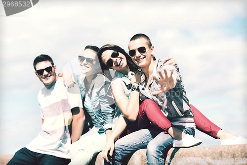 Image of group of teenagers hanging out