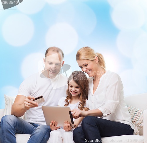 Image of happy family with tablet pc and credit card