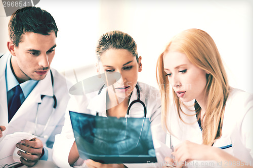 Image of young group of doctors looking at x-ray