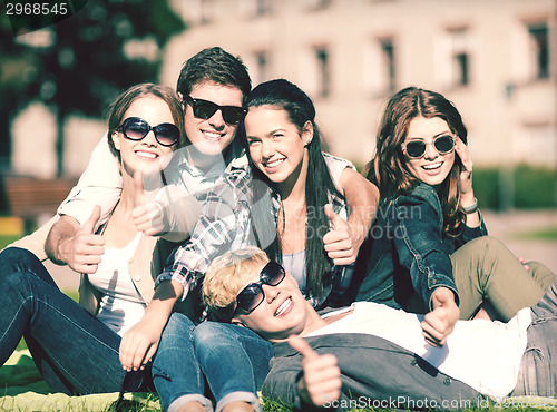 Image of group of students or teenagers showing thumbs up