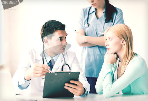 Image of male doctor with patient