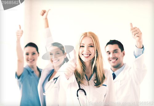 Image of group of doctors showing thumbs up