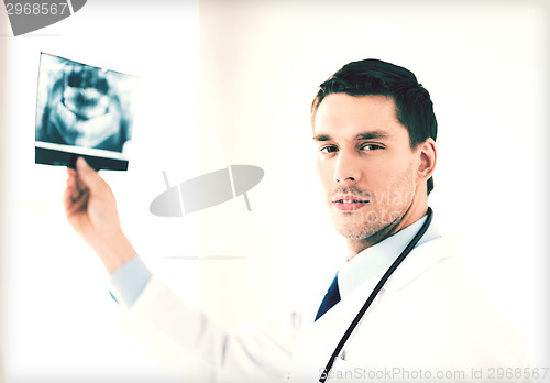 Image of male doctor or dentist with x-ray