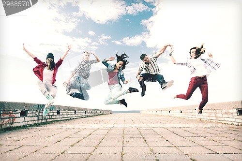 Image of group of teenagers jumping