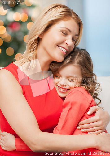 Image of hugging mother and daughter