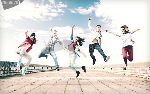 Image of group of teenagers jumping