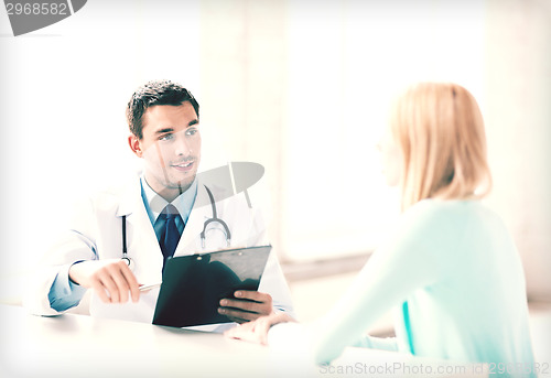 Image of male doctor with patient