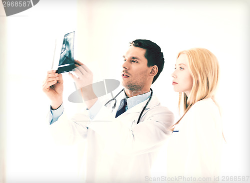 Image of two doctors looking at x-ray