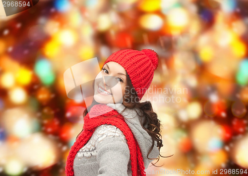 Image of smiling young woman in winter clothes