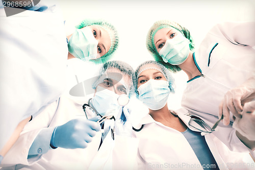 Image of group of doctors in operating room