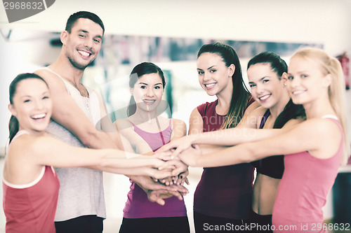 Image of group of people in the gym celebrating victory