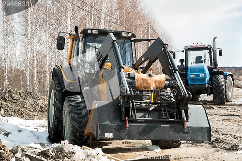 Image of Plow tractors on agricultural machinery exhibition