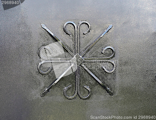 Image of Forged pattern on a black metal gate as a backdrop