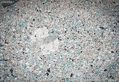 Image of Background of small blue, gray, white and black small granules w