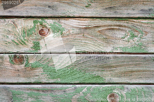 Image of Texture of wall made of planks with paint peeling off close-up