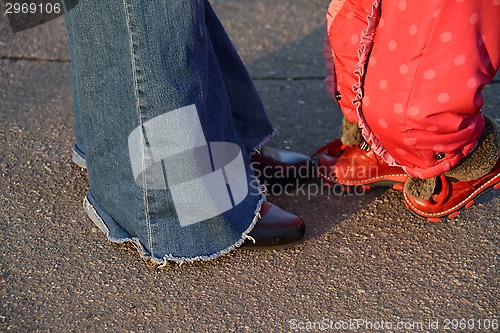 Image of being together conceipt: a baby girl legs and mother legs