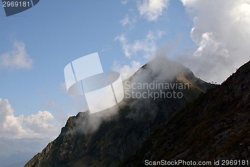 Image of A cloudon the top of the mountain