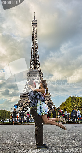 Image of Happy Young Couple in Front of the Eiffel Tower