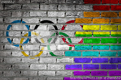 Image of Dark brick wall - LGBT rights - Olympic flag