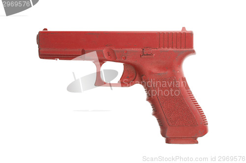 Image of Dirty red training gun isolated on white