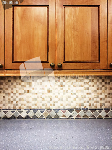 Image of Kitchen with wooden cabinets and tile decor