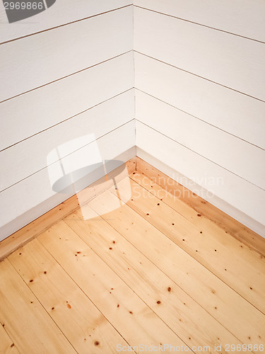 Image of Empty room corner with wooden floor