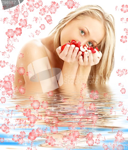 Image of blond with red and white rose petals in water with flowers #2