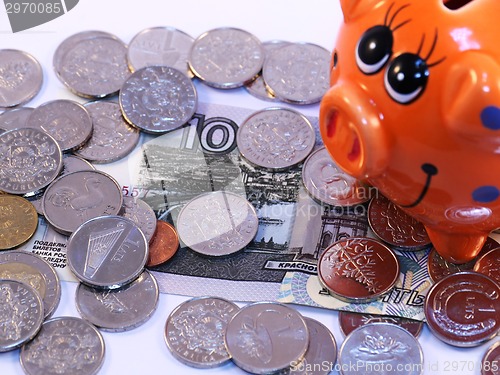 Image of Bunch of coins and piggy bank