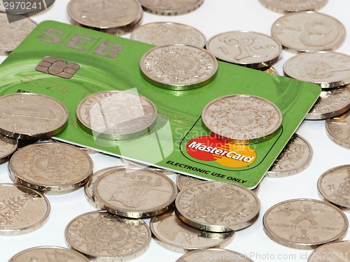 Image of Bunch of coins with credit card