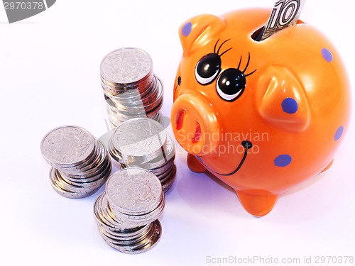 Image of Bunch of coins and piggy bank