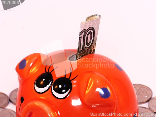 Image of Bunch of coins and piggy bank